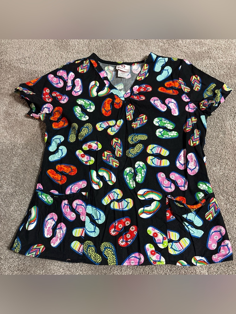 Flip flop pattern scrub top